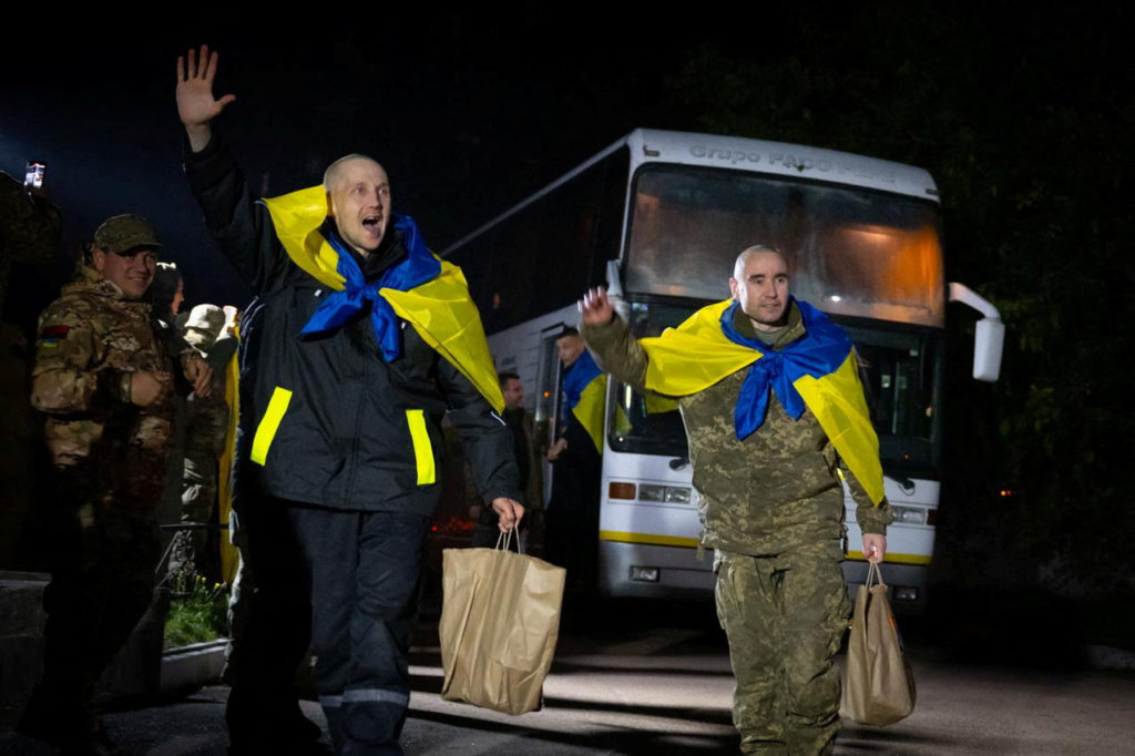 Ukrainian POWs react after a swap in an undisclosed location in Ukraine