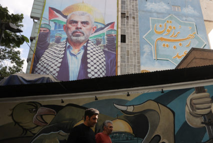 A billboard with a picture of the late Hamas leader Yahya Sinwar is displayed on a building in Tehran