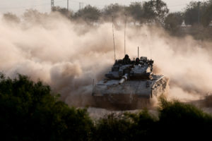 An Israeli tank manouvres near the Israel-Gaza border
