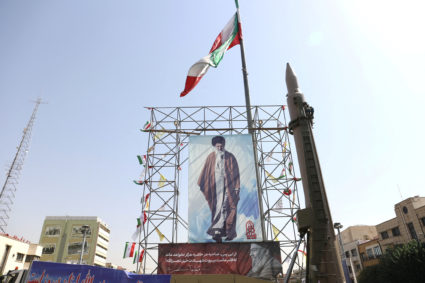 FILE PHOTO: An Iranian missile system is displayed next to a banner with a picture of Iran's Supreme Leader Ayatollah Ali ...