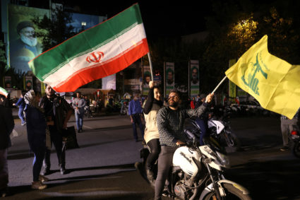 Iranians celebrate on a street, after the IRGC attack on Israel, in Tehran