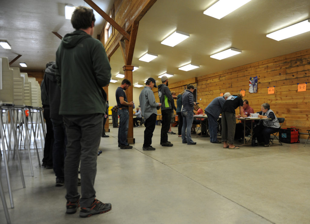 Voters wait in line to vote at the Gallatin County Fairgrounds in Bozeman