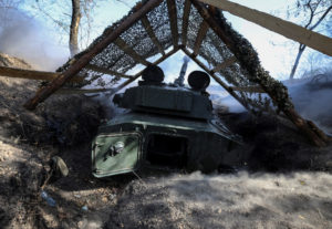 Ukrainian servicemen fire a self-propelled howitzer towards Russian troops at a frontline near the town of Pokrovsk