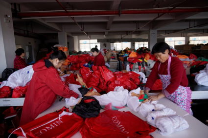 Employees make Christmas products at Goosh toy factory in Yiwu