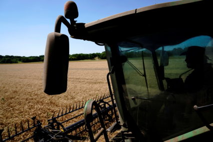 An farmer near Skedee, Oklahoma, harvests winter wheat. Photo by Nick Oxford/Reuters