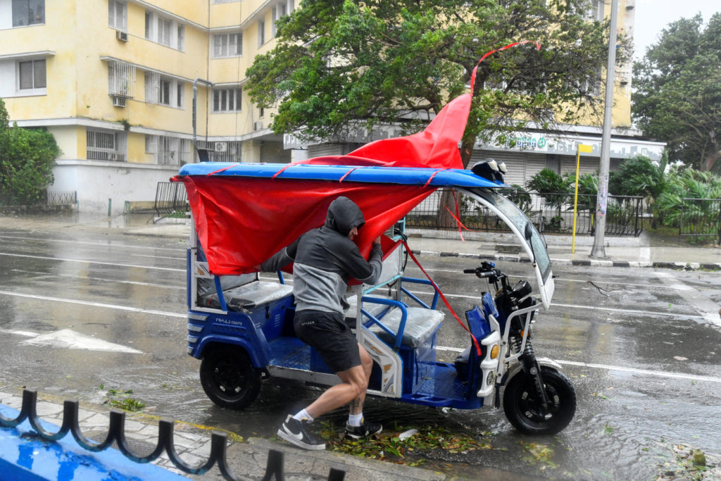 Hurricane Rafael strengthens as winds and rain begin to lash Cuba