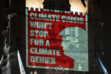 Climate activists project a message onto Tower Bridge ahead of COP29 climate talks, in London