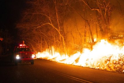 A firefighter monitors the Jennings Creek Wildfire impacting Passaic County, NJ and Orange County, NY