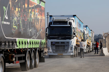 Trucks with humanitarian aid destined for the Gaza Strip queue at the Kerem Shalom crossing in southern Israel