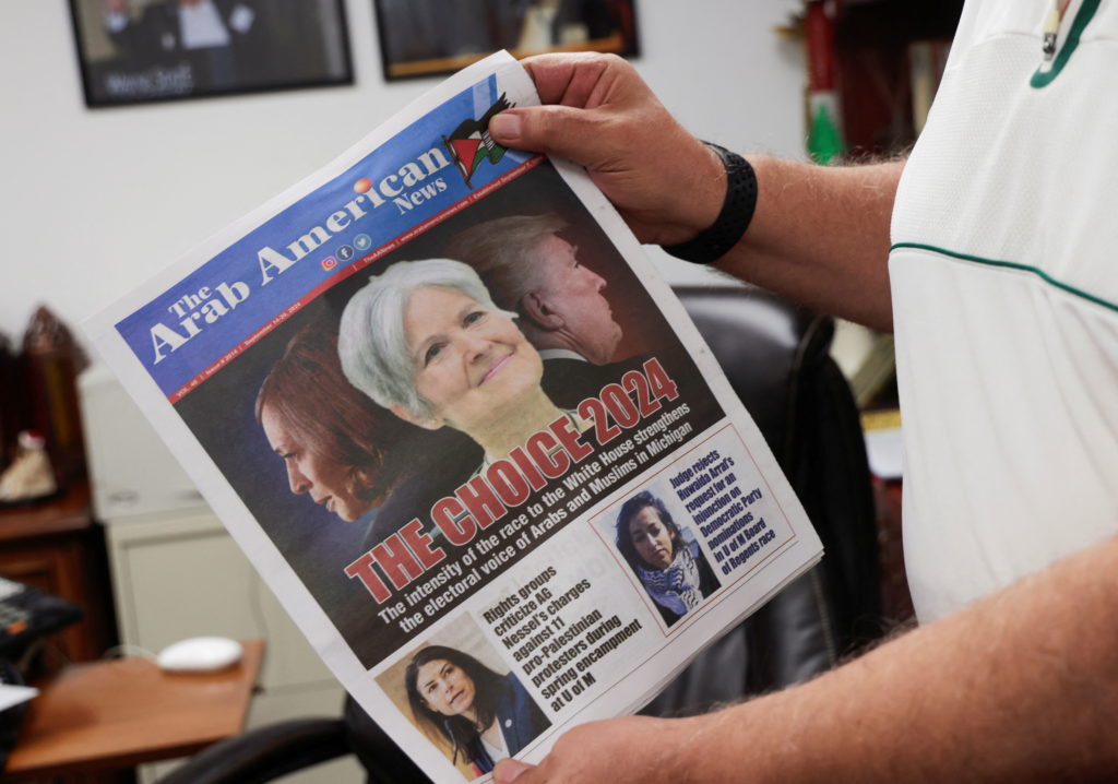 The Arab American News publisher Osama Siblani shows the newspaper cover with the lead story of 'the electoral voice of Ar...