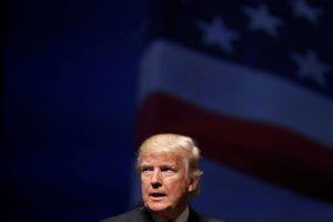 Republican presidential nominee Donald Trump stands on stage during a campaign town hall meeting in Virginia Beach