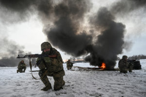 Ukrainian service members attend a military exercises in Chernihiv region