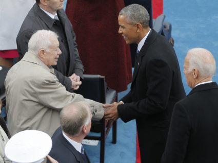 President Barack Obama and Vice President Joe Biden are greeted by former President Jimmy Carter prior to the inauguration...