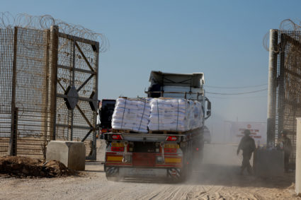A truck carries humanitarian aid destined for the Gaza Strip at the Kerem Shalom crossing in southern Israel