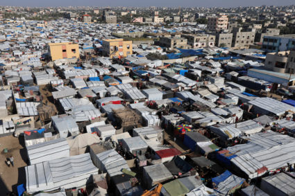 Displaced Palestinians shelter at a tent camp, amid the Israel-Hamas conflict, in Deir Al-Balah in the central Gaza Strip