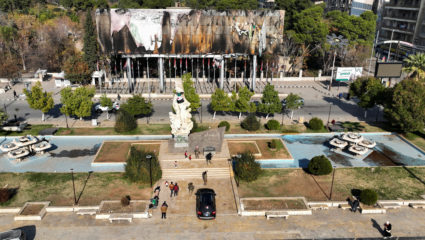 A drone view shows a damaged poster of Syria's President Bashar al-Assad at Saadallah al-Jabiri Square in Aleppo