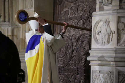 PHOTOS: An archbishop's knock heralds Notre Dame's reopening as world leaders look on