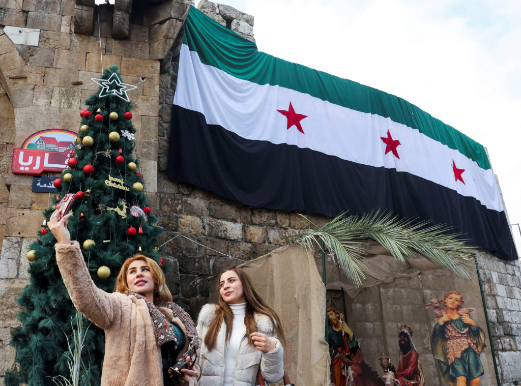 People visit the Bab Touma square in Damascus