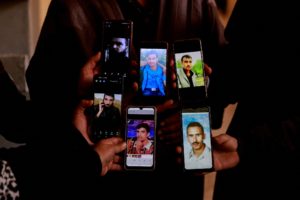 People and members of the Syrian civil defence group search Sednaya prison