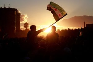 People celebrate after fighters of the ruling Syrian body ousted Bashar al-Assad, in Damascus