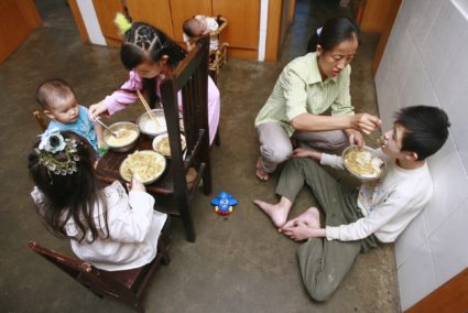 Intellectually disabled children are fed at a welfare institute in Suining