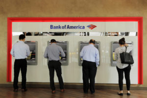 People withdraw money from Bank of America ATMs in New York