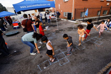 Advocacy groups organize a party for residents of the Edge at Lowry apartment complex in Aurora