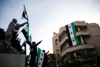 People celebrate after Syrian rebels announced that they had ousted President Bashar al-Assad, in Majdal Shams