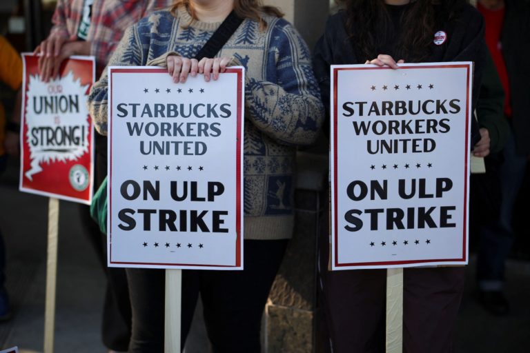 Baristas picket in front of a Starbucks in Burbank