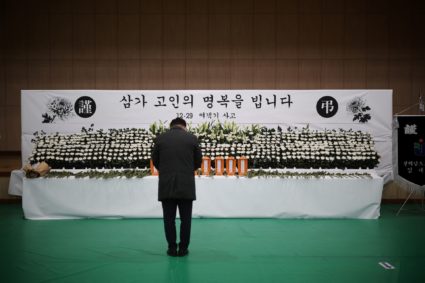 A man mourns at a memorial altar for government officials of Jeollanam-do Office of Education and students who died in the...