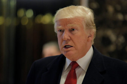U.S. President-elect Donald Trump speaks to members of the news media in the main lobby at Trump Tower in New York