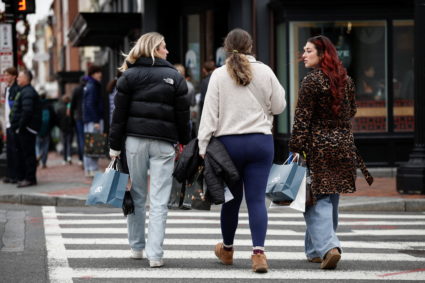Customers carry shopping bags on Black Friday in the Georgetown neighborhood of Washington