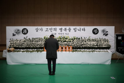 A man mourns at a memorial altar for government officials of Jeollanam-do Office of Education and students who died in the...