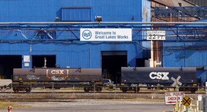 FILE PHOTO: Train cars are seen in front of the Great Lakes Works United States Steel plant in River Rouge