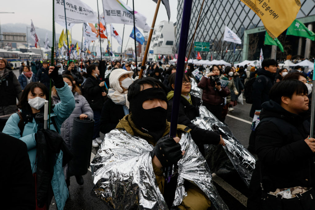 Protesters attend a demonstration against impeached South Korean President Yoon Suk Yeol, near his official residence in S...