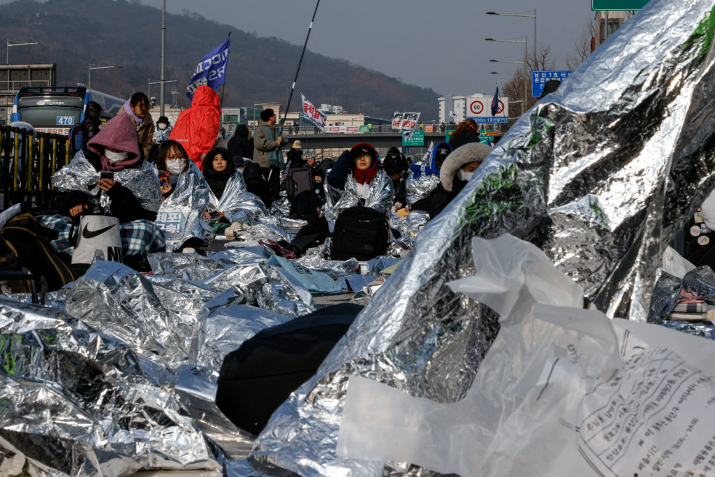 People take part in a protest against the impeached South Korean President Yoon Suk Yeol near his official residence in Seoul