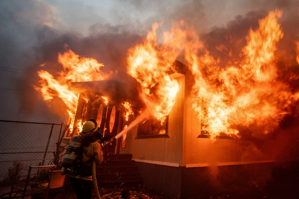 Crews report gains against massive LA wildfires as winds and arsonists ...