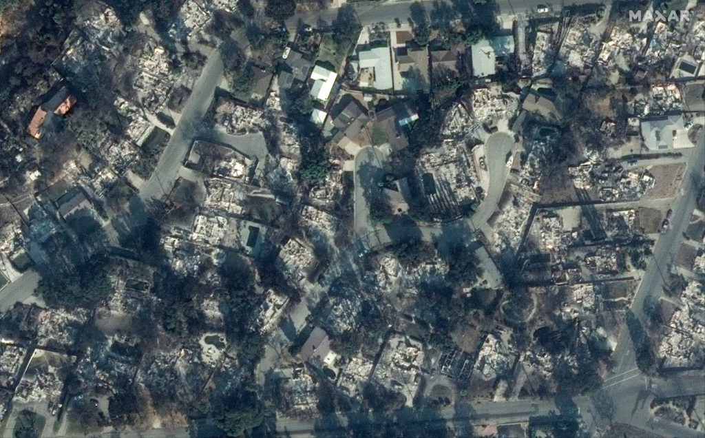 A satellite image shows destroyed homes along W Loma Alta Drive after the fires in Altadena