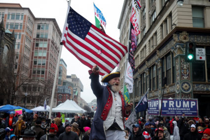 Supporters line up outside Capital One Arena, ahead of a rally for U.S. President-elect Donald Trump, in Washington