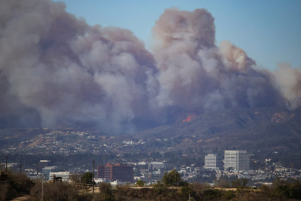 A wildfire burns near Pacific Palisades on the west side of Los Angeles