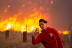 Firefighters and aircraft battle the Hughes Fire near Santa Clarita