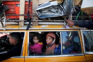 Displaced Palestinians make their way back to their homes in northern Gaza, amid a ceasefire between Israel and Hamas, in ...