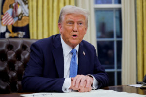U.S. President Donald Trump signs an executive order in the Oval Office at the White House