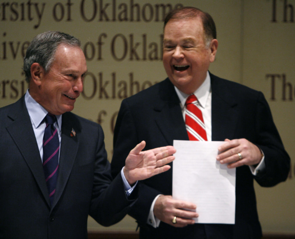 New York City Mayor Michael Bloomberg laughs with David Boren during a bipartisan forum at the University of Oklahoma