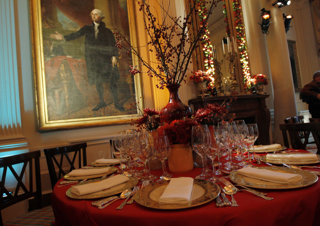 Portrait of first U.S. President Washington is shown alongside table setting before State Dinner hosted by U.S. President ...