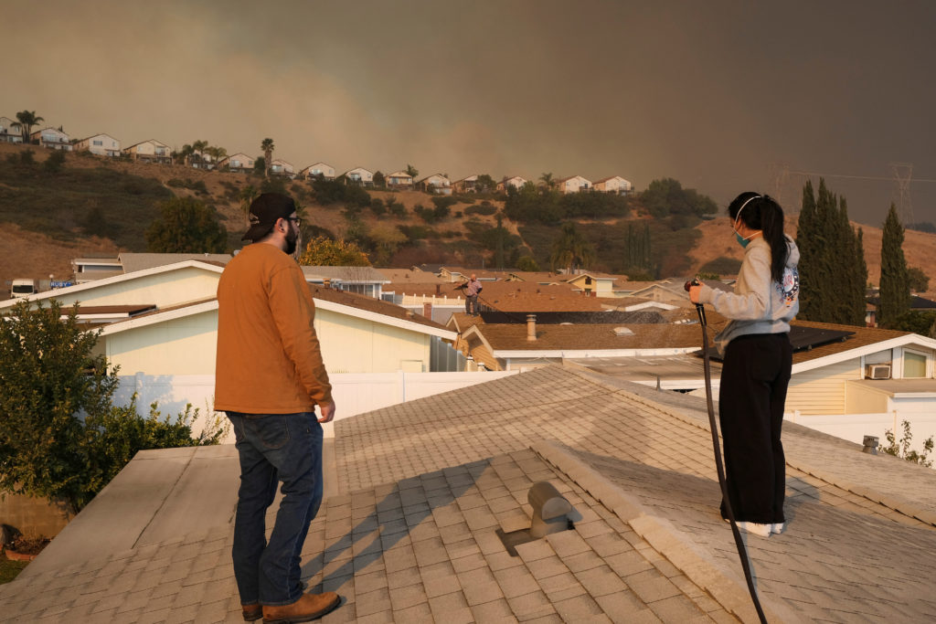 Residents evacuate amid the Hughes Fire, in Castaic