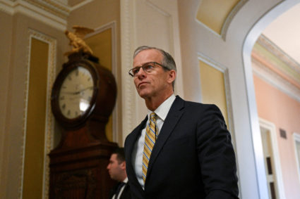 FILE PHOTO: Senate Majority Leader John Thune (R-SD) walks to the Senate Chamber ahead of a session on Capitol Hill in Was...