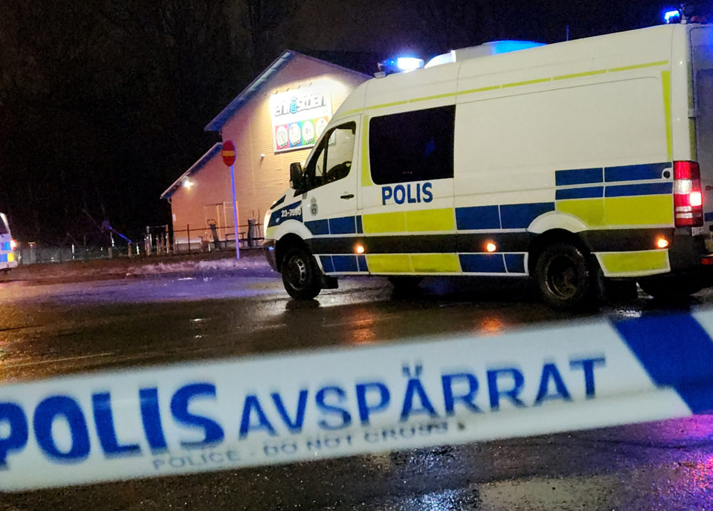 A police van is pictured near the adult education center Campus Risbergska school after a shooting attack in Orebro