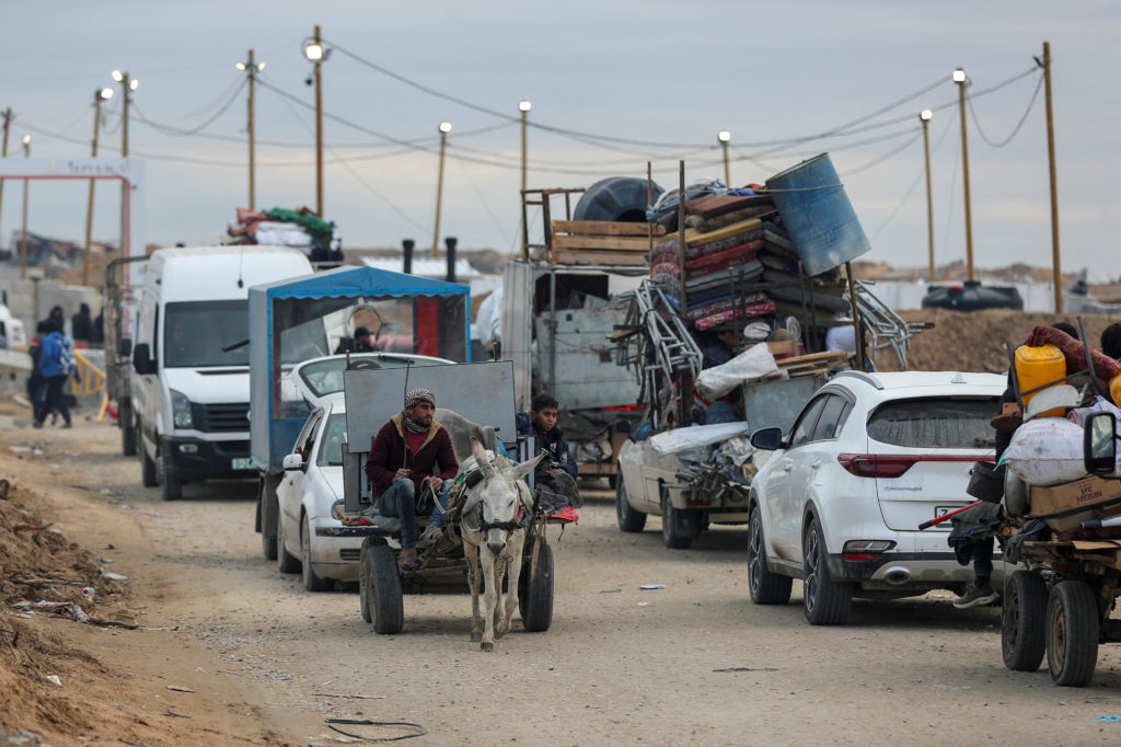 Palestinians make their way after Israeli forces withdrew from the Netzarim Corridor, near Gaza City