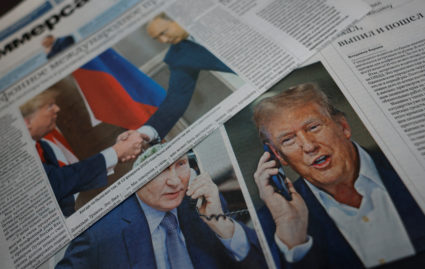 View of newspaper covers dedicated to Putin-Trump phone call at newsstand in Moscow